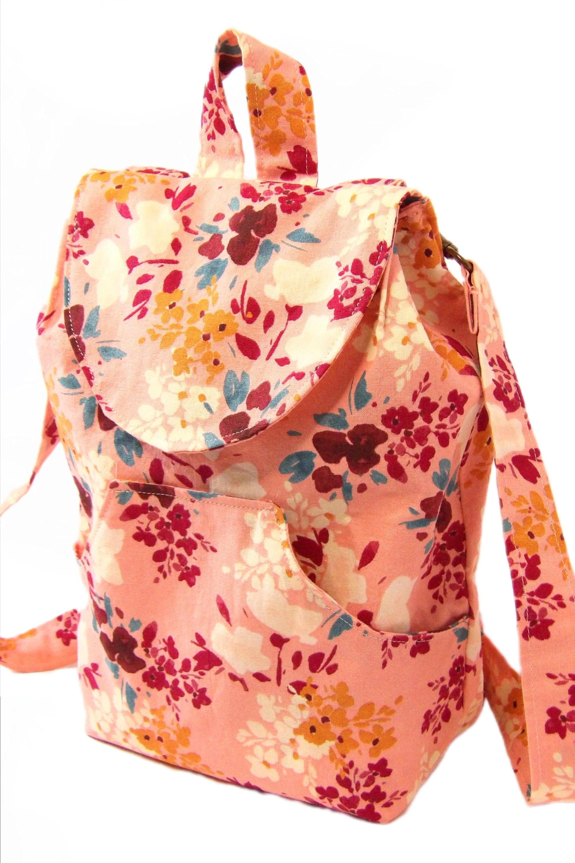 convertible mini backpack purse for women with wildflower cotton fabric. Convertible backpack purse that can be worn as a sling bag. Boho style mini backpack photo of the front. Bohemian floral fabric