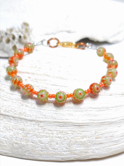orange and green millefiori glass beaded bracelet in bohemian style accented by orange czech glass seed beads
