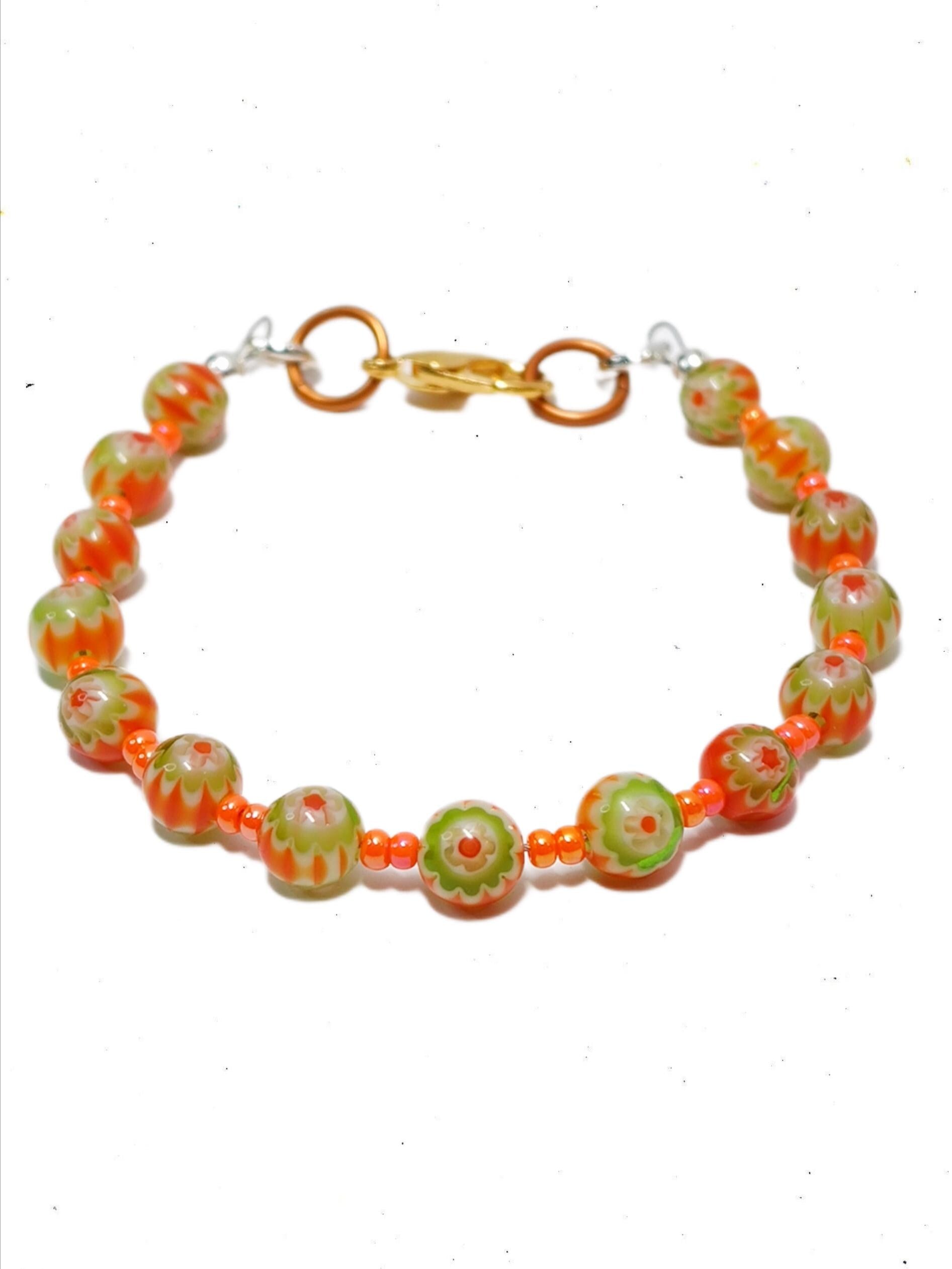 orange and green millefiori glass beaded bracelet in bohemian style accented by orange czech glass seed beads