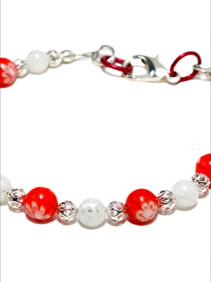 red and white millefiori  beaded bracelet made with floral mosaic beads. Handmade  boho style Pacific Northwest Jewlery, USA