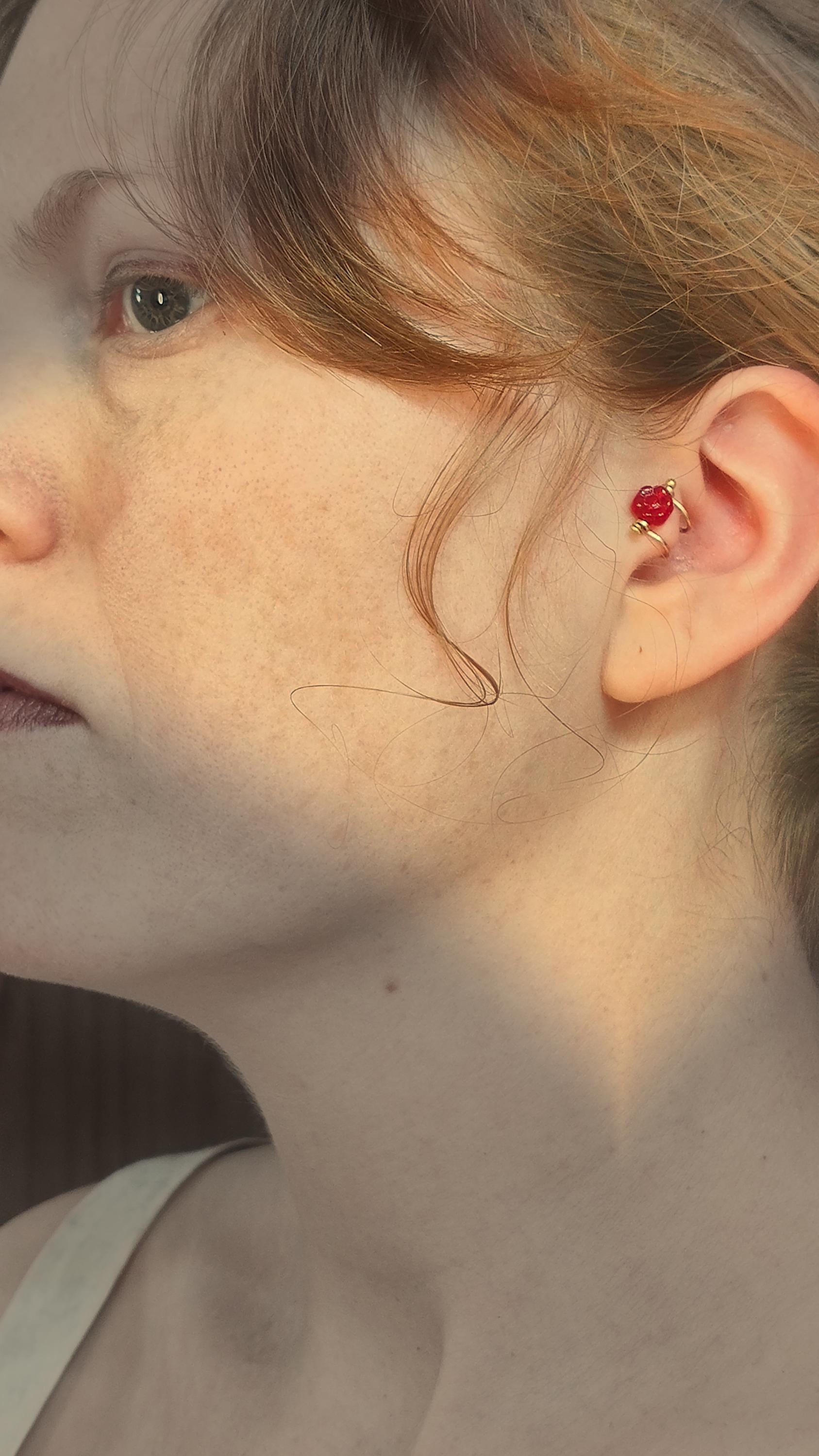 Flower ear cuff with bronze frame and red Czech glass flower bead. Wildflower inspired boho jewelry. No piercing ear cuff for women