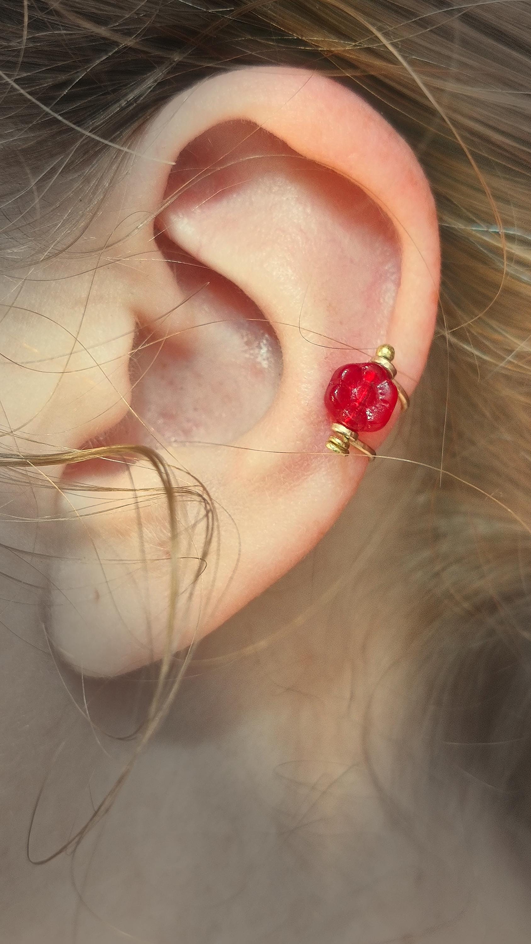 Flower ear cuff with bronze frame and red Czech glass flower bead. Wildflower inspired boho jewelry. No piercing ear cuff for women