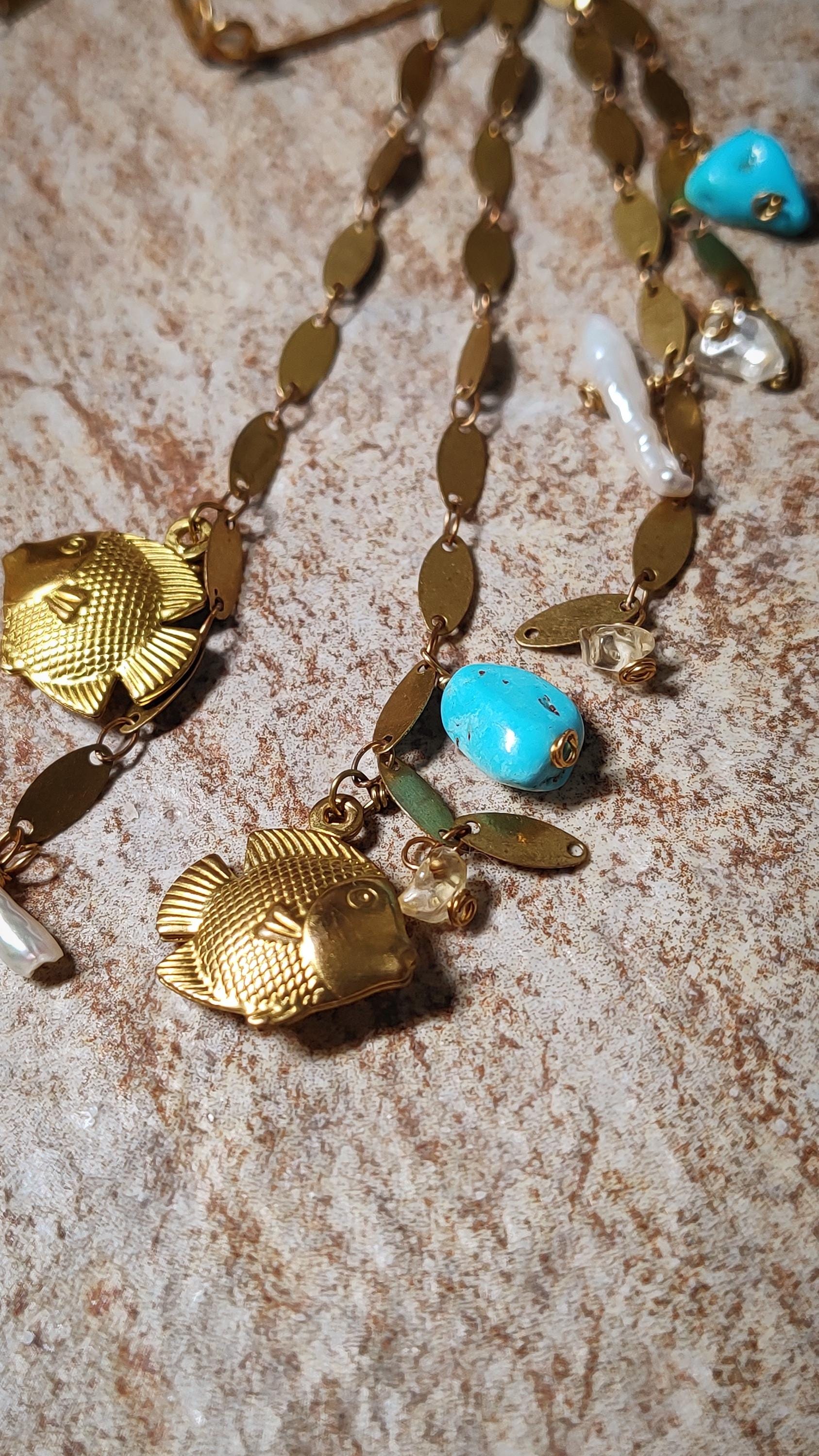 Ocean Wrap Around Earring With Natural Turquoise, pearls and citrine. Adorned with brass sequin chains and fish charms to create a siren style beachy ear cuff.