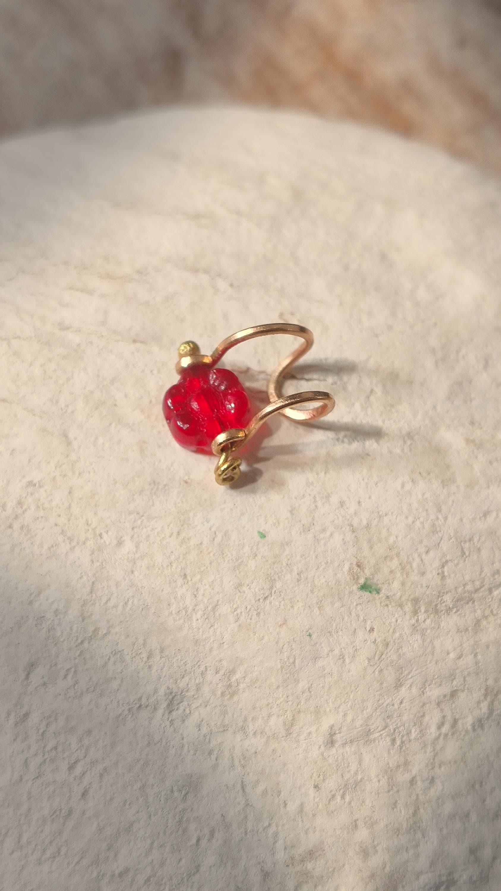 Flower ear cuff with bronze frame and red Czech glass flower bead. Wildflower inspired boho jewelry. No piercing ear cuff for women