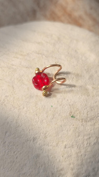 Flower ear cuff with bronze frame and red Czech glass flower bead. Wildflower inspired boho jewelry. No piercing ear cuff for women