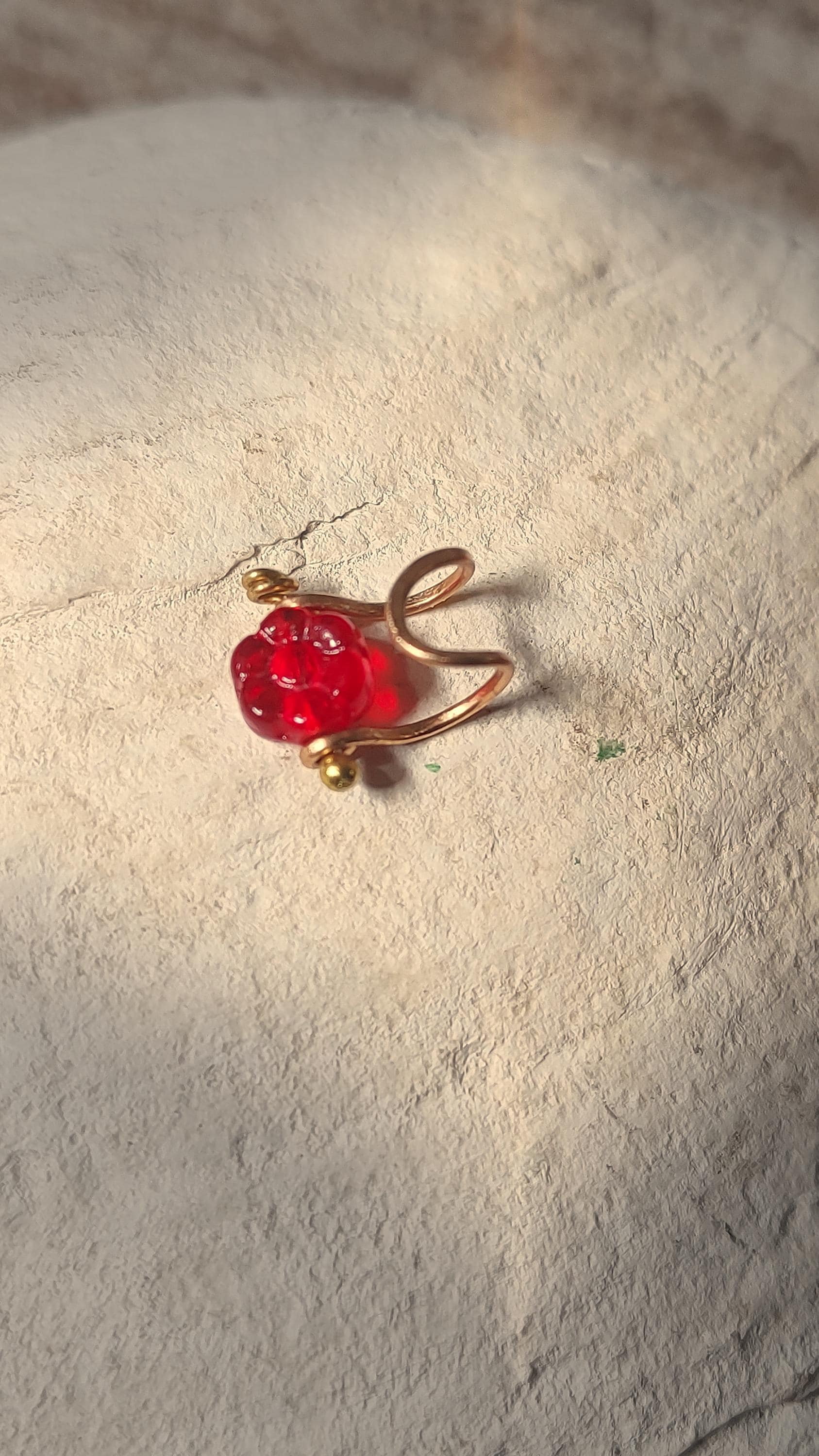 Flower ear cuff with bronze frame and red Czech glass flower bead. Wildflower inspired boho jewelry. No piercing ear cuff for women