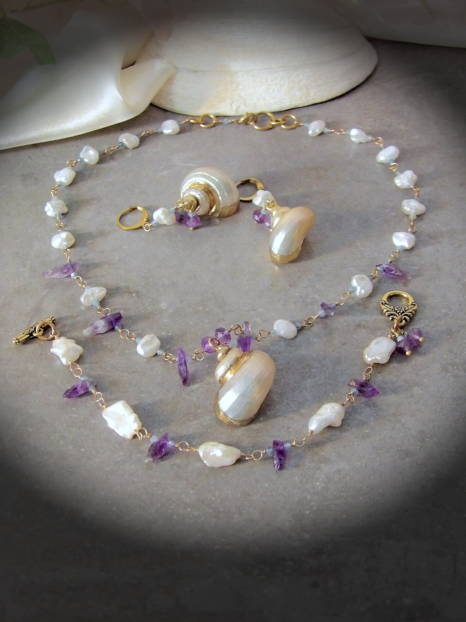 irregular pearl earrings. Baroque pearl earrings with aquamarine and amethyst and shell